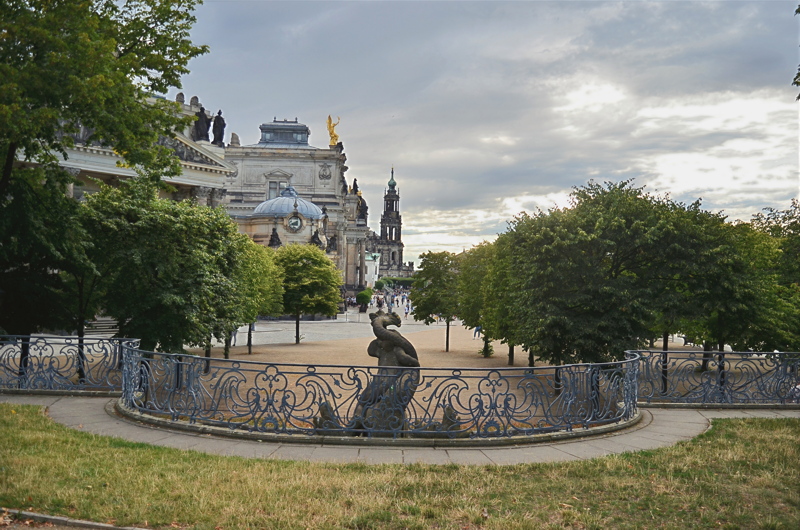 27 - The historic Brühl's Terrace in Dresden, Germany, featuring the decorative iron railing, the Dolphin Fountain and landmark architecture like the Cathedral in the background